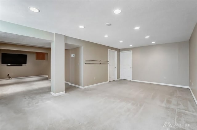 below grade area featuring carpet flooring, recessed lighting, and baseboards