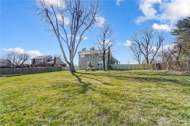 view of yard with a fenced backyard