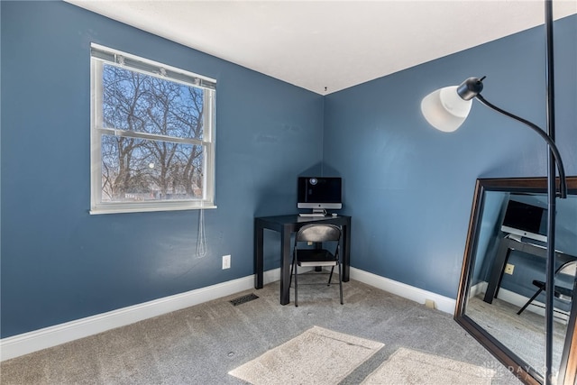 office space featuring visible vents, baseboards, and carpet