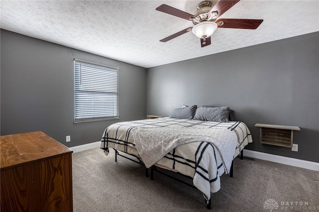 bedroom with carpet flooring, ceiling fan, a textured ceiling, and baseboards