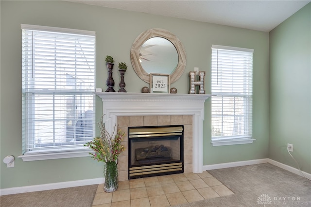 interior details with a fireplace and baseboards