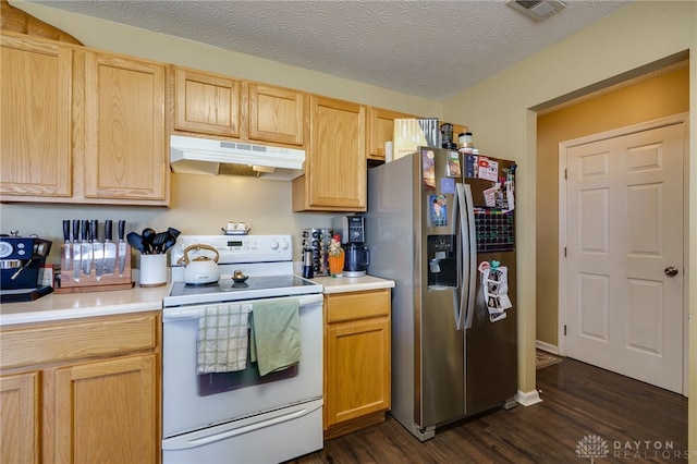 kitchen with visible vents, light countertops, stainless steel refrigerator with ice dispenser, under cabinet range hood, and white range with electric stovetop