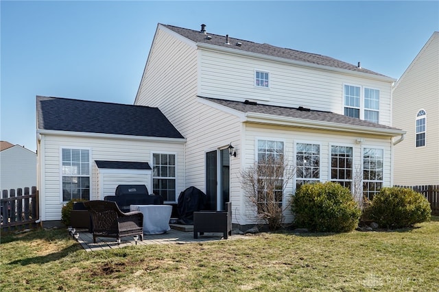 back of house with a yard, a patio area, and fence