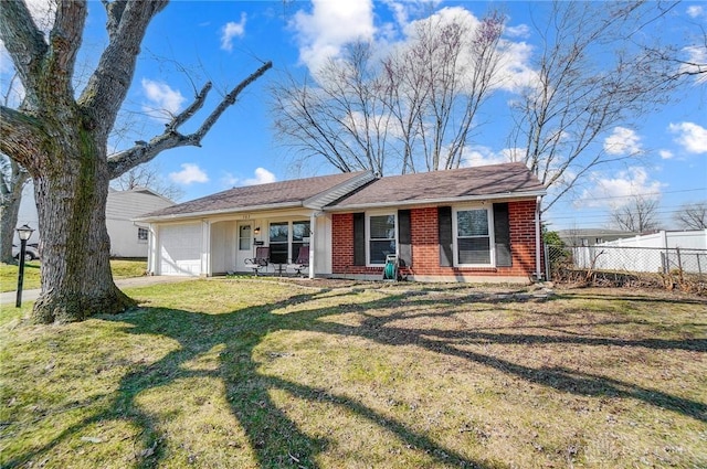 single story home featuring brick siding, an attached garage, a front lawn, and fence