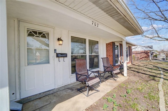 doorway to property featuring covered porch