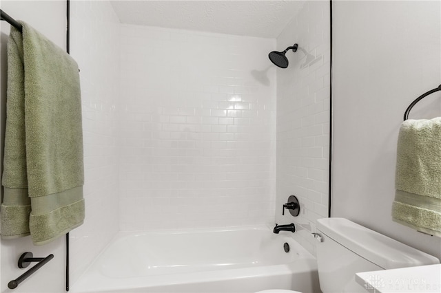 bathroom featuring a textured ceiling, toilet, and shower / bath combination