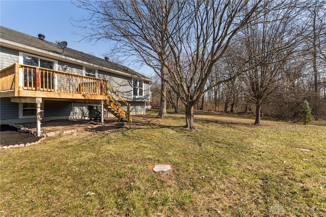 view of yard featuring a deck and stairs