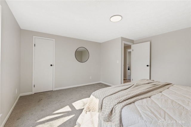 carpeted bedroom with baseboards