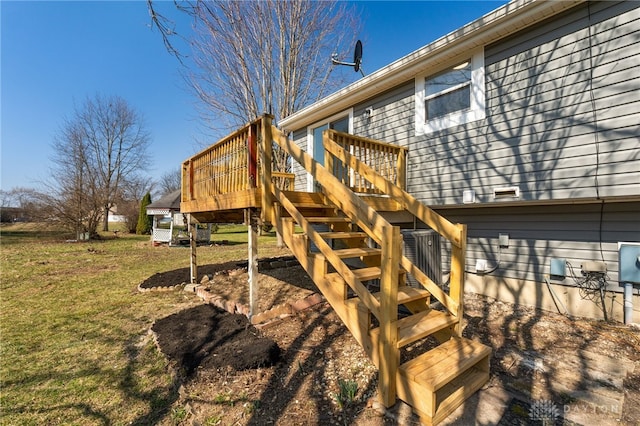 exterior space featuring stairs and a yard