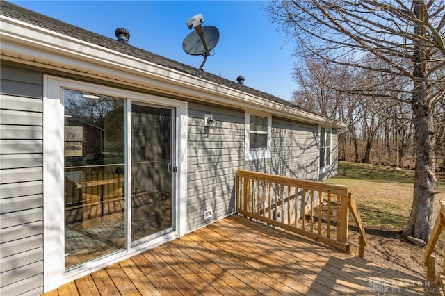 deck featuring a lawn