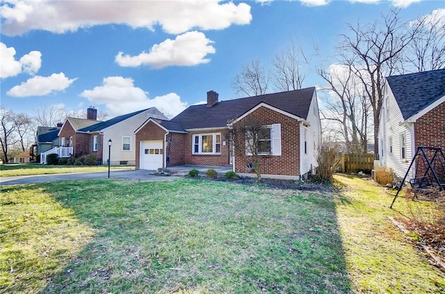 view of front facade featuring a front yard, driveway, a chimney, a garage, and brick siding