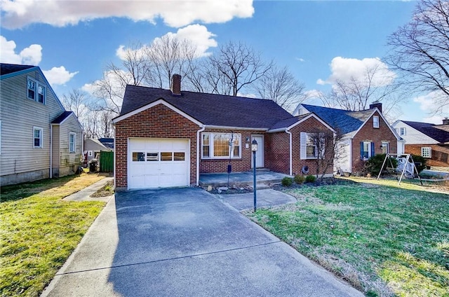 view of front facade featuring concrete driveway, a front yard, an attached garage, brick siding, and a chimney