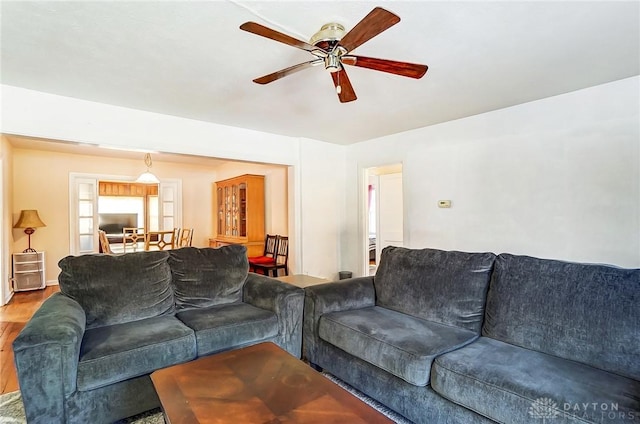 living room featuring wood finished floors and ceiling fan