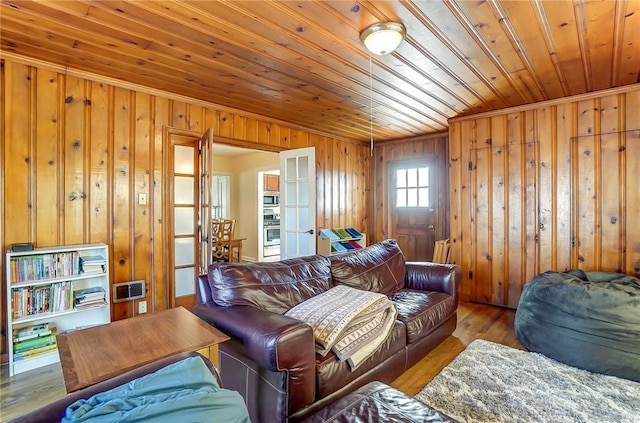 living room with hardwood / wood-style flooring, wooden walls, and wood ceiling