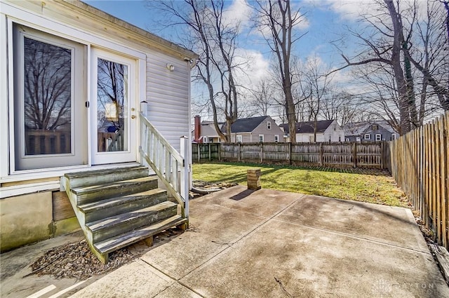 view of patio / terrace featuring entry steps, a fenced backyard, and a residential view