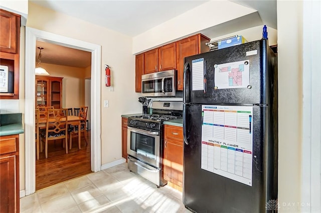 kitchen featuring brown cabinets and stainless steel appliances