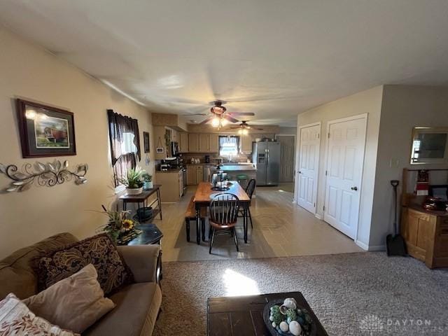 living area with a ceiling fan