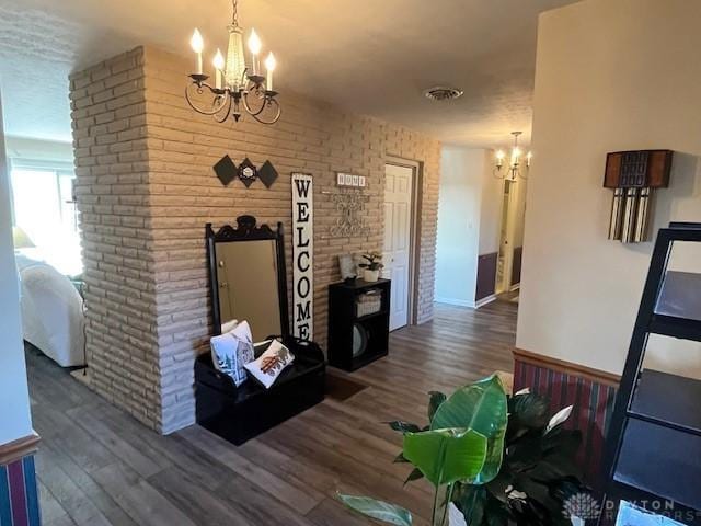 dining room featuring wood finished floors and a chandelier