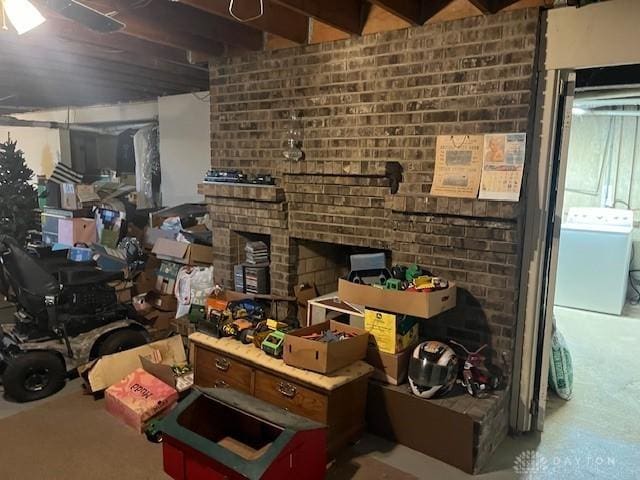 interior space with washer / dryer and a fireplace