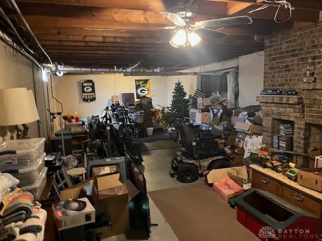 unfinished basement with a large fireplace