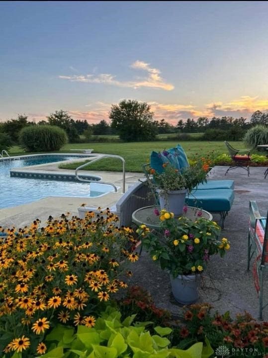 view of patio with an outdoor pool