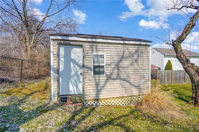 view of shed with a fenced backyard