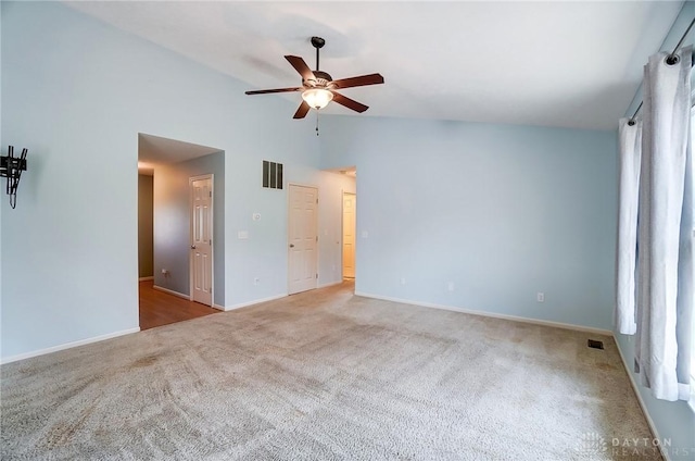 spare room with visible vents, baseboards, ceiling fan, and carpet floors