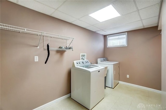 laundry area with washer and dryer, laundry area, and baseboards