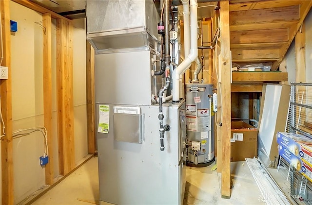 utility room with heating unit and gas water heater