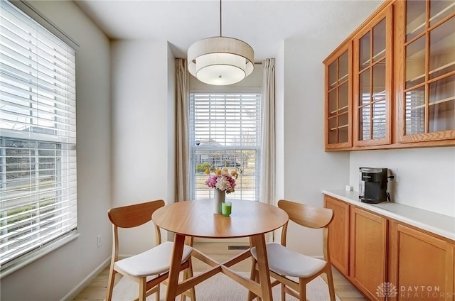 dining area featuring baseboards