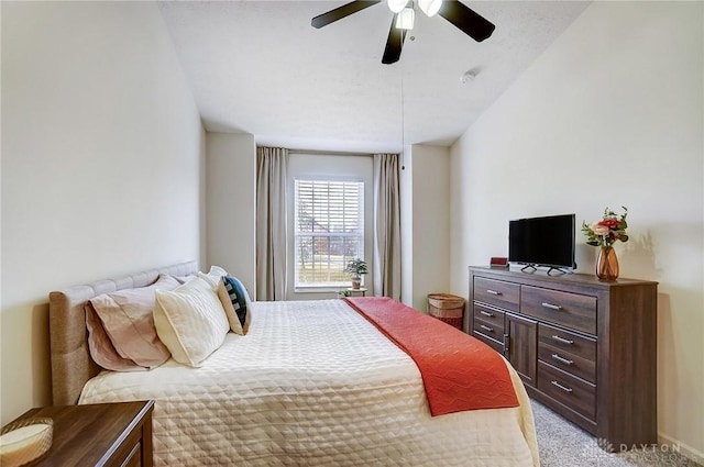 bedroom featuring light carpet and a ceiling fan