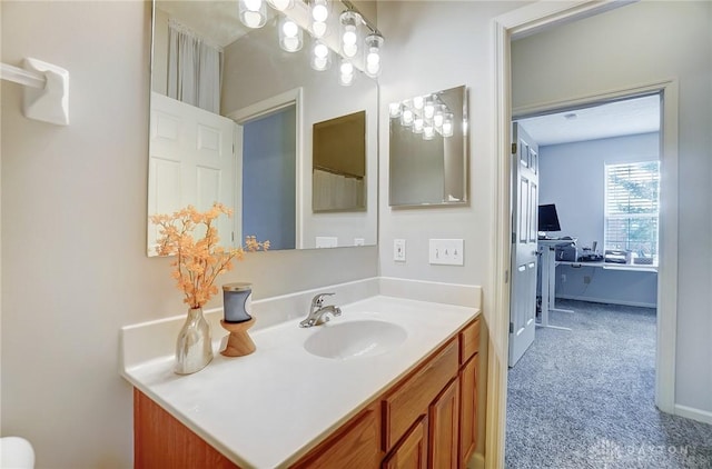 full bathroom featuring vanity and baseboards