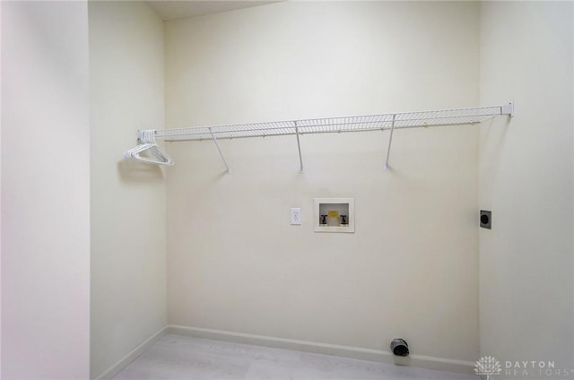 laundry room with baseboards, hookup for an electric dryer, washer hookup, and laundry area