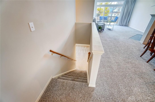 staircase with carpet and baseboards