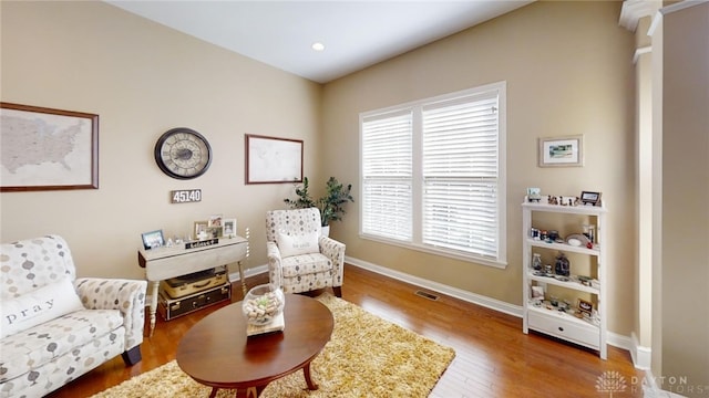 sitting room with visible vents, recessed lighting, wood finished floors, and baseboards