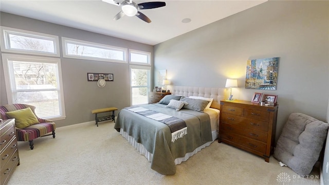 bedroom with baseboards, light colored carpet, and ceiling fan