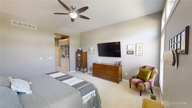 bedroom with a ceiling fan, carpet flooring, baseboards, and visible vents