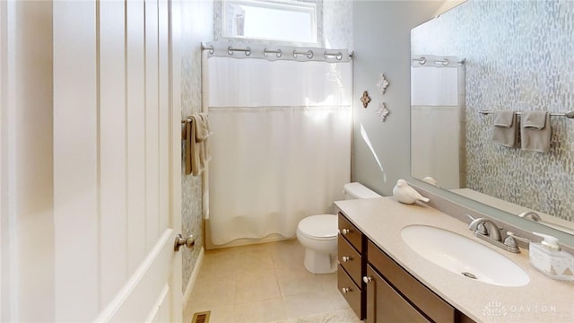 bathroom featuring visible vents, toilet, shower / tub combo, tile patterned flooring, and vanity