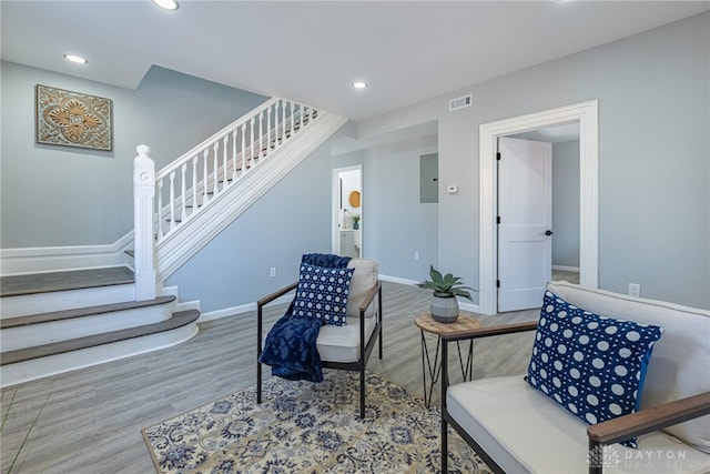 sitting room featuring recessed lighting, visible vents, wood finished floors, and stairway