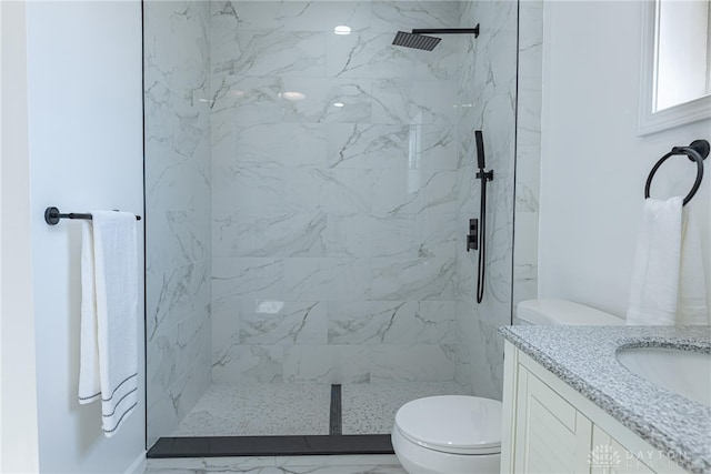 bathroom with a marble finish shower, marble finish floor, toilet, and vanity