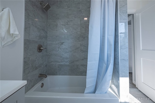 full bath featuring vanity and shower / tub combo