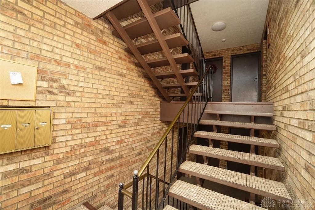 stairway with brick wall