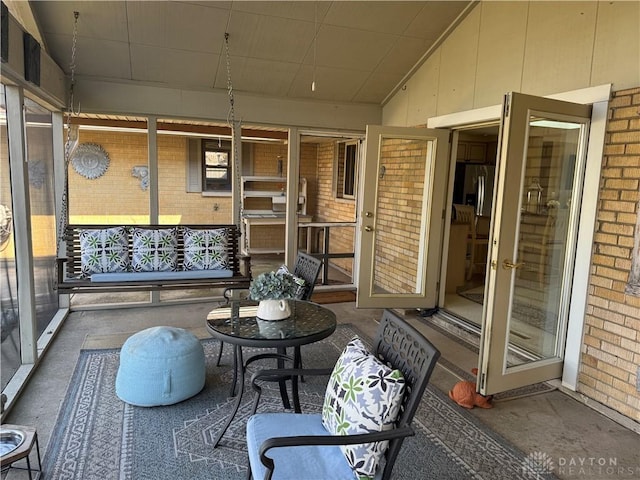 sunroom / solarium with vaulted ceiling