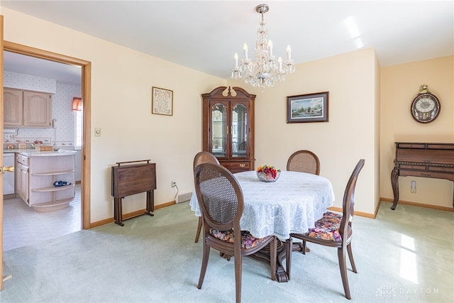 dining space with wallpapered walls, light colored carpet, baseboards, and a chandelier