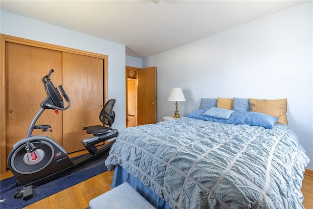 bedroom with a closet and wood finished floors