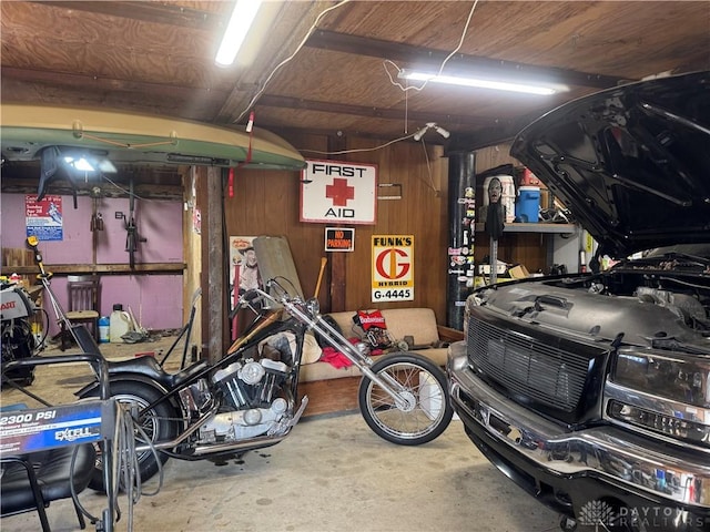 garage featuring wooden walls