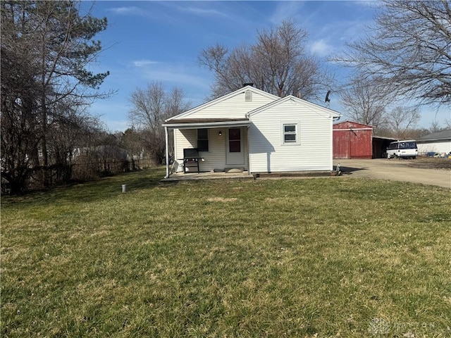 exterior space featuring a porch, driveway, and a front yard