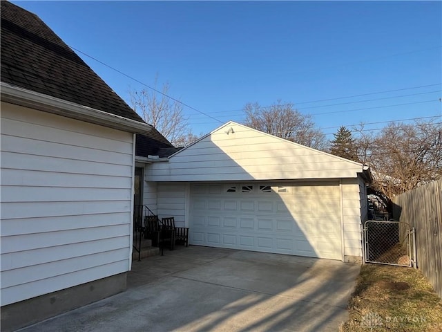 garage featuring a gate and fence