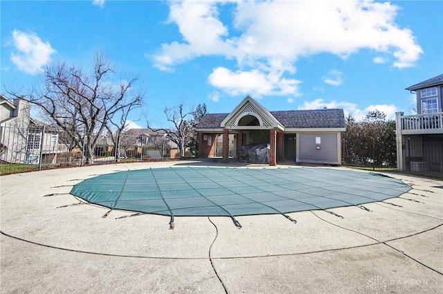 pool featuring a patio and fence