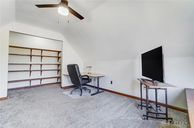 carpeted home office with lofted ceiling, a ceiling fan, and baseboards